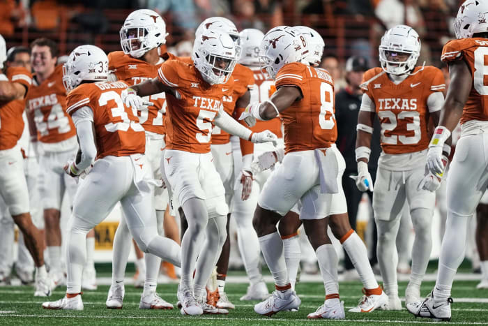 The Texas Longhorns defense celebrates another stop